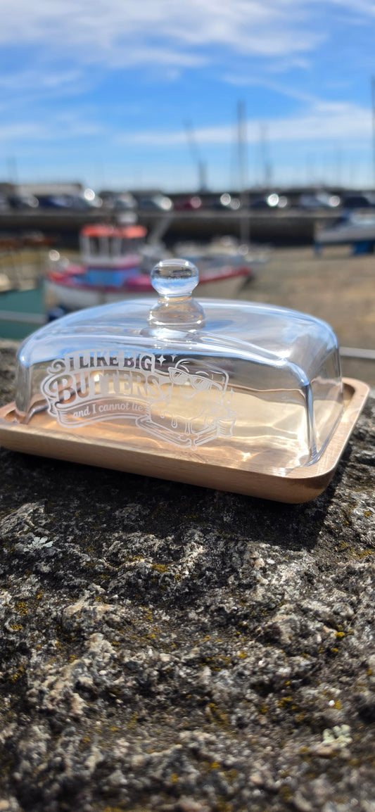 Clear glass container with a lid attached to a stone wall