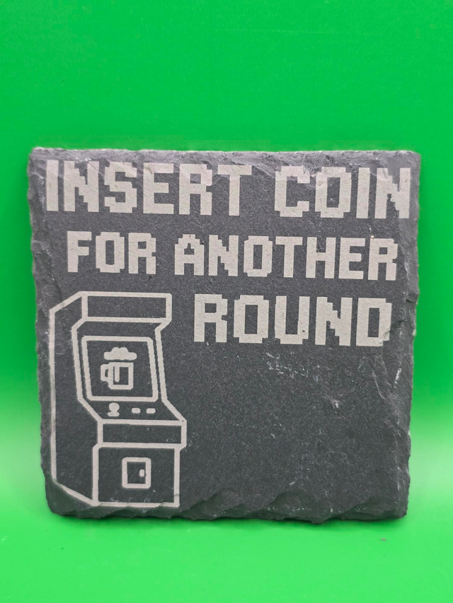 Insert coin for another roung slate coaster