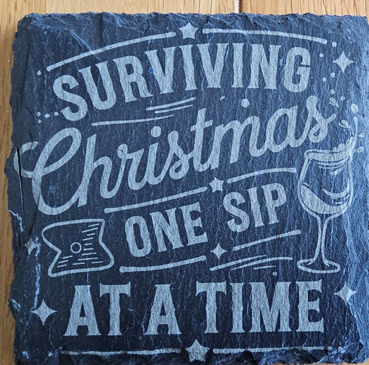 Surviving Christmas one sip at a time engraved slate coaster